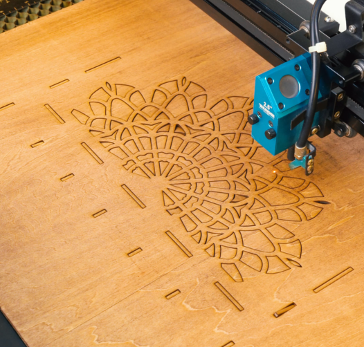laser cutting the wall hanger.png