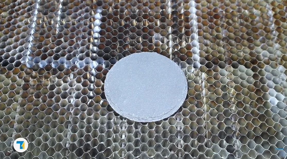put the slate coaster on the laser bed.webp