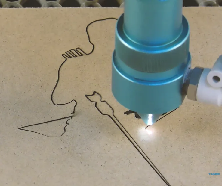 laser cutting the book stand.webp