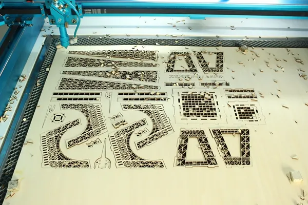 laser cut the Eiffel Tower model.webp