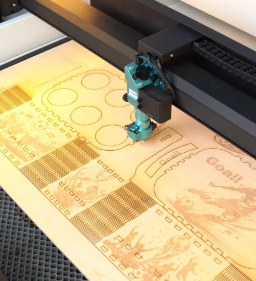 laser cutting the wood.webp