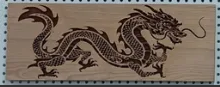 Deep engraved dragon on cherry wood.